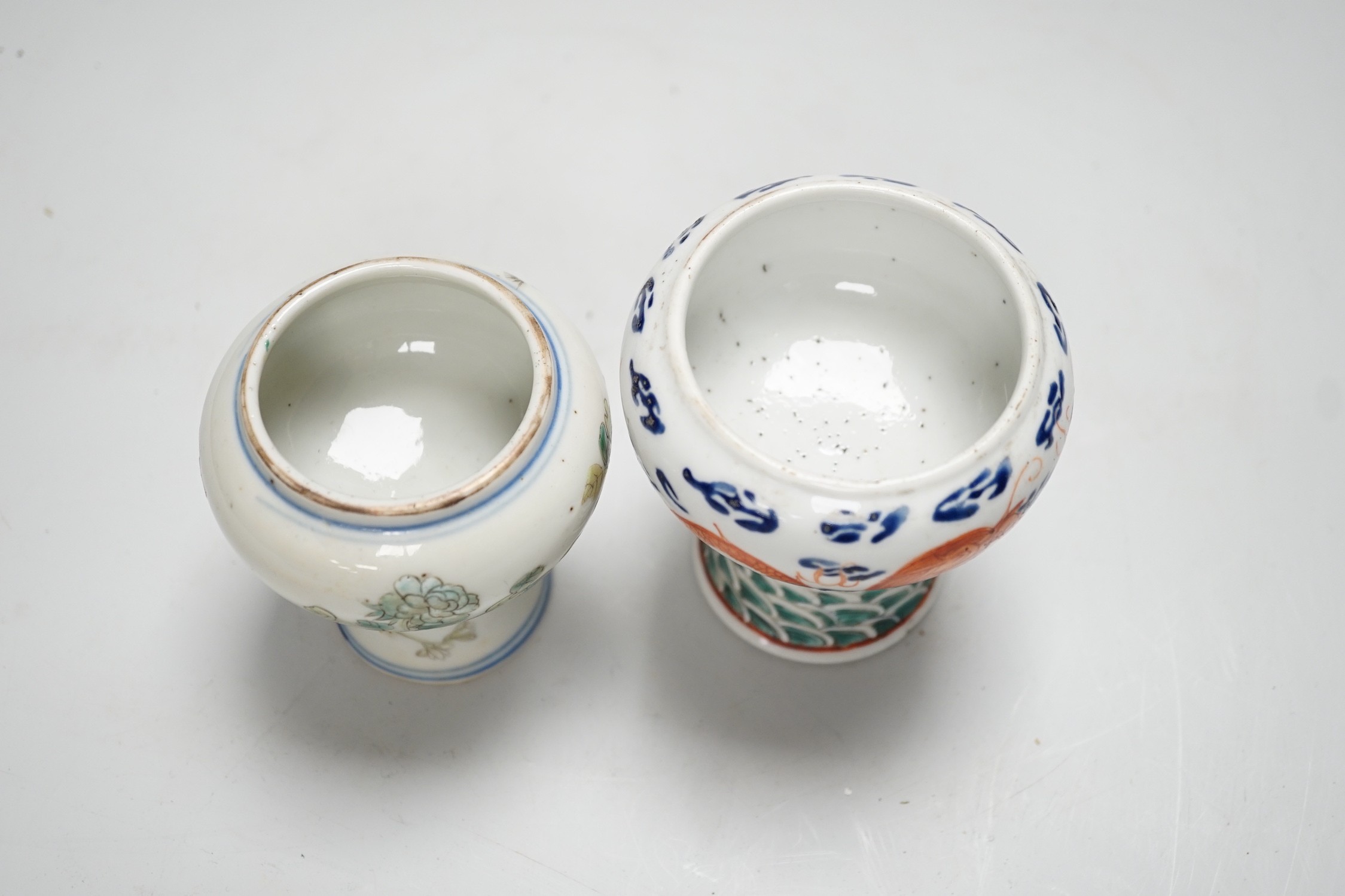 Two 19th century Chinese enamelled porcelain stem bowls, The first painted with Dragons chasing a flaming pearl, 10cm, the second painted with a bird amid flowers